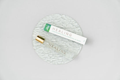 Healing Roller bottle on textured glass plate