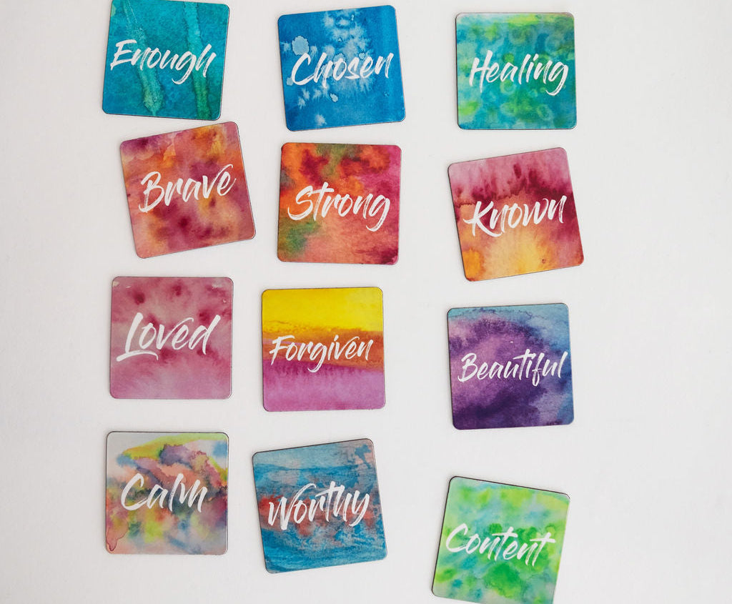 12 mini affirmation magnets grouped together on a white background