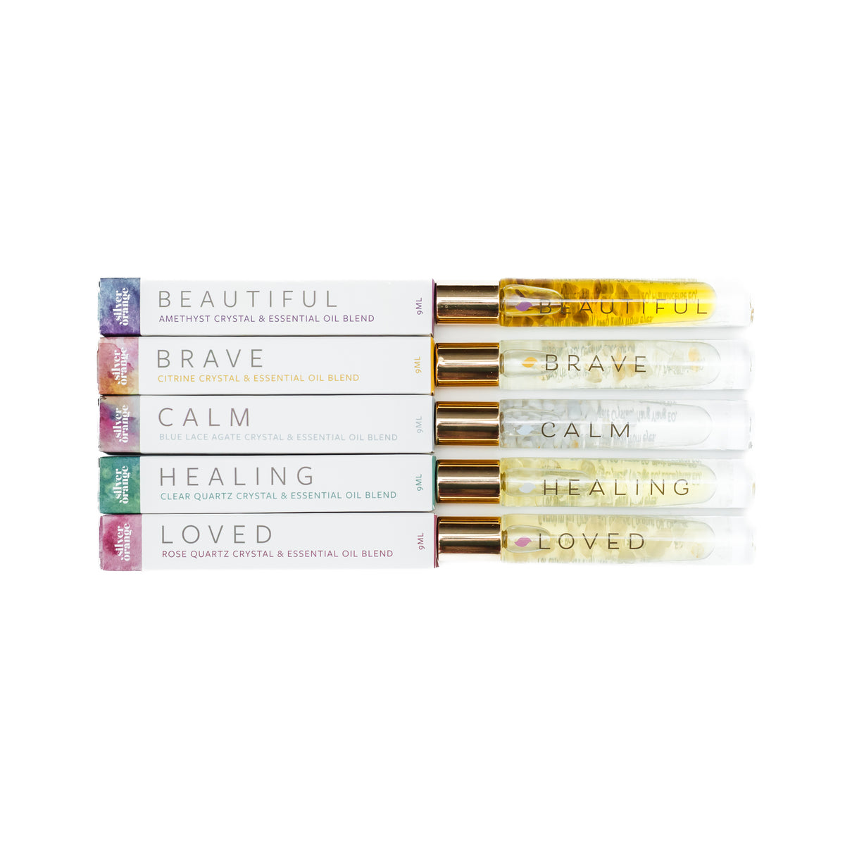 Stack of essential oil blends with labels on a white background