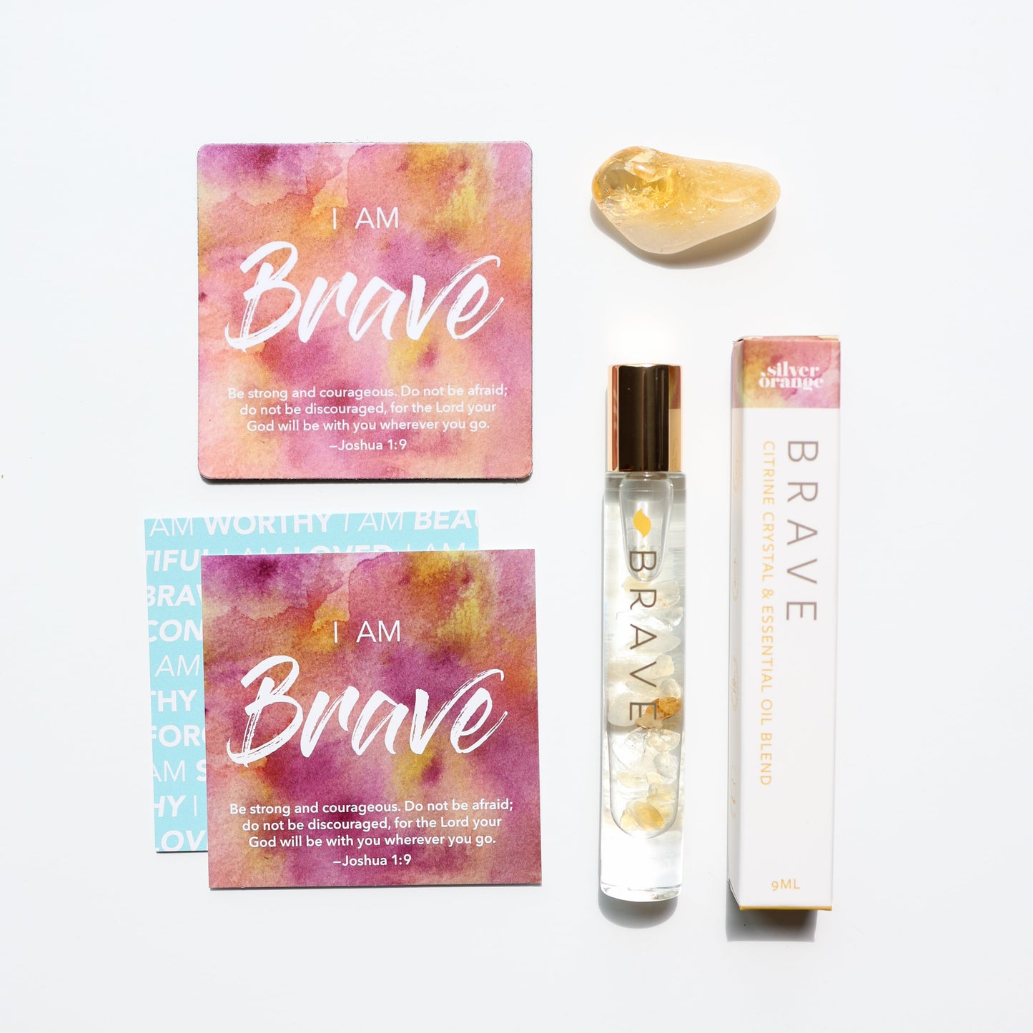 Product set with 'I AM Brave' cards and a rollerball on a white background