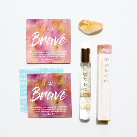 Product set with 'I AM Brave' cards and a rollerball on a white background