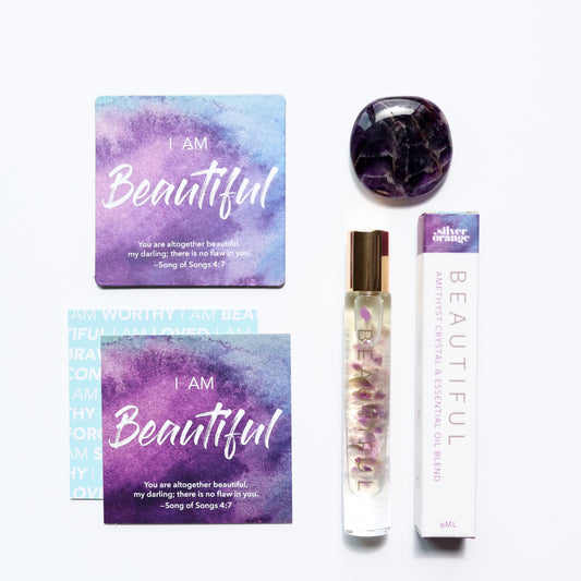 Product set with 'I AM Beautiful' motivational cards, a bottle, and a compact mirror on a white background.